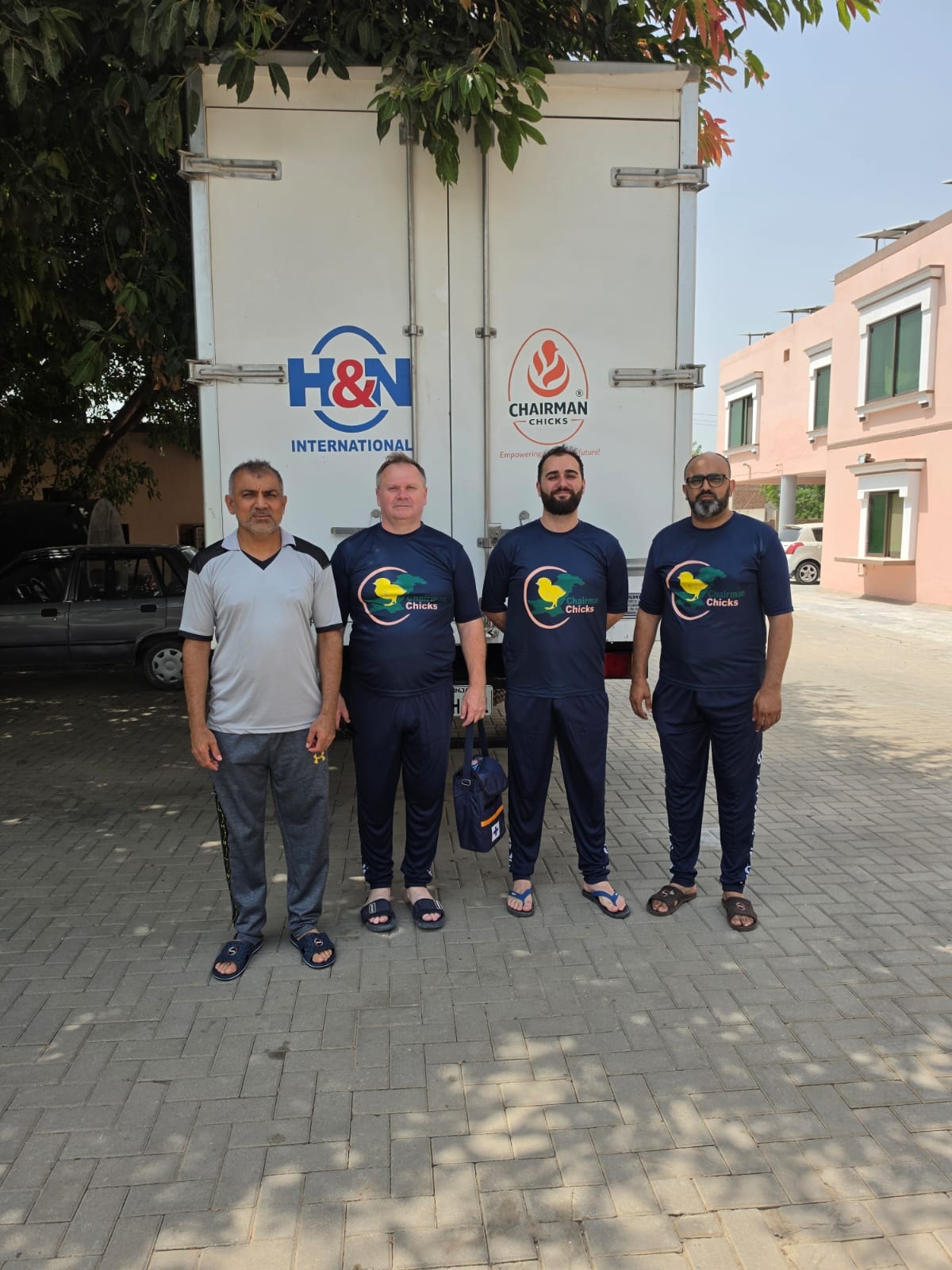 Group photo of H&N International representatives and Chairman Chicks team outside the hatchery